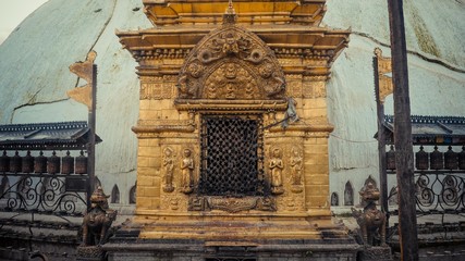 A golden doorway with chain at entrance