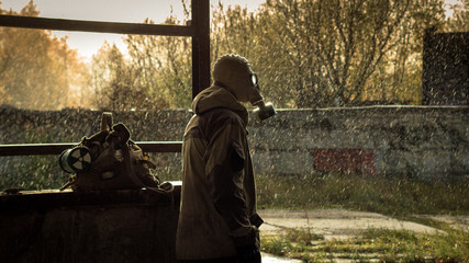 stalker with soviet gas mask in radioactive zone