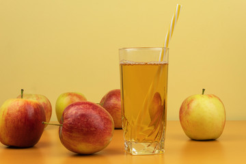 Useful apple juice in a glass background for text