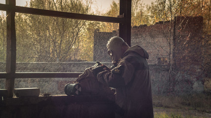 stalker with soviet gas mask in radioactive zone