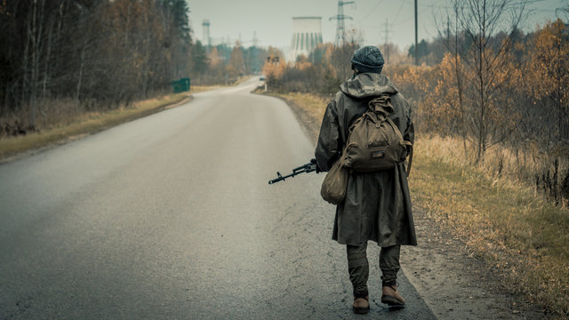 stalker with soviet gas mask in radioactive zone