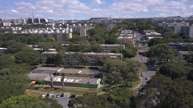 Beautiful drone aerial view of Brasilia city skyline with "Asa Norte" buildings neighborhood on sunny summer day. Concept of urban, modern, cityscape, architecture, landmarks.