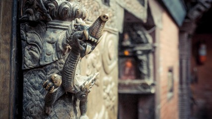 Close up of a dragon sculpture on the wall