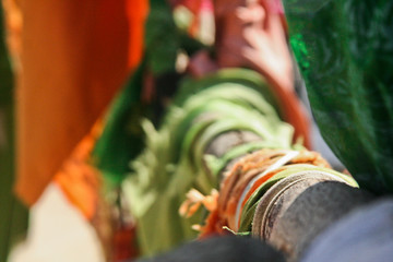 Colourful cloth been tied on the tree branch