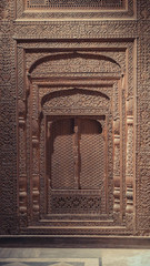 Detail engraved wood door on the wall