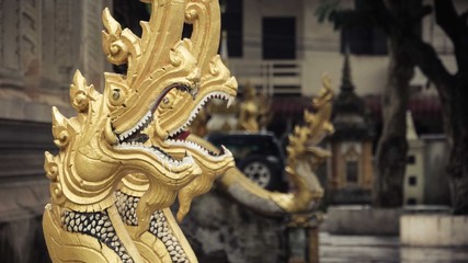 Dragon with white teeth and yellow skin statue
