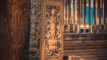Engraved wood of person on the wall
