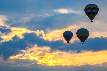 lots of balloons with people flying in the morning sky in Cappadocia