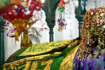 Hanging crafts and flowers around the coffin