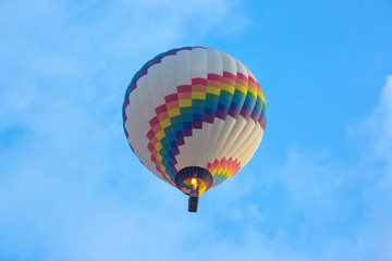 colored balloon with people flying in the sky in Cappadocia