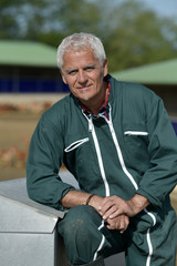 Portrait of farmer in poultry yard