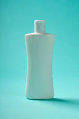 White bottle over blue background