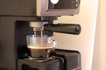 Machine makes natural coffee in glass cup
