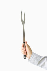 Barbecue fork in female hands on a white background