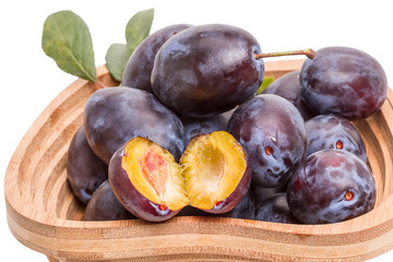 Ripe Prunes in a wooden vase