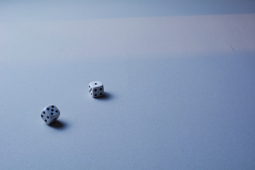 Two dice in motion, on white background,