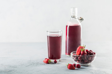 The concept of a summer refreshing drink made from red berries: berry Morse made from fresh...