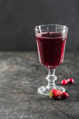 The concept of a summer refreshing drink from red berries: berry Morse of fresh strawberries and cranberries