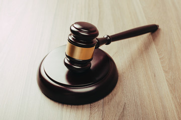 Symbol of law and justice on wooden table in lawyer office