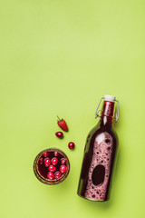 The concept of a summer refreshing drink from red berries: berry Morse of fresh strawberries and...