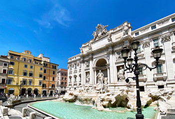 The Trevi Fountain in Rome with the first tourists after the lockdown due to the coronavirus pandemic. Access to the fountain is still prohibited