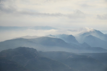 A misty morning at  Monserrat. Montserrat is a multi-peaked rocky range located near the city of Barcelona, in Catalonia, Spain.