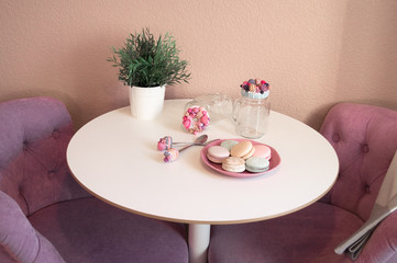 round table with cookies and decorative utensils