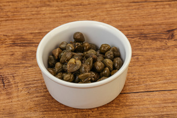 Tasty capers in the bowl