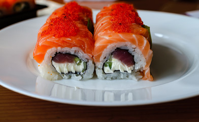 rolls and sushi on a light background, tasty food at home