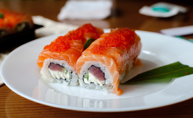 rolls and sushi on a light background, tasty food at home