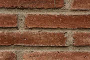Red brick wall close up view for background.