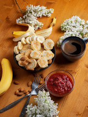 mini pancakes with banana and a Cup of coffee. trendy Breakfast