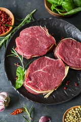 Obraz na płótnie Canvas Raw organic beef steak with spices