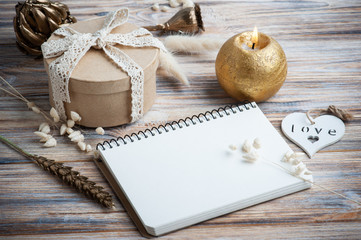 Empty notebook with golden dry flowers