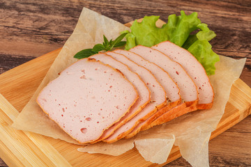 Boiled pork sausage over board