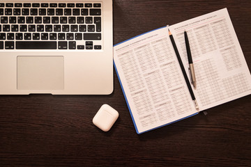 Notebook, pen, pencil and notebook on the table. Remote work.