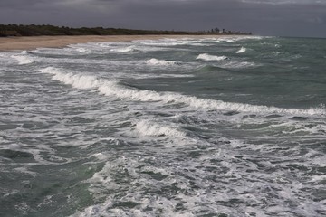 Small waves breaking on the beach