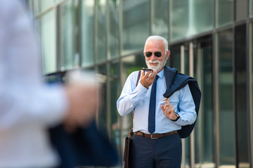 Senior lawyer walking and talk on phone