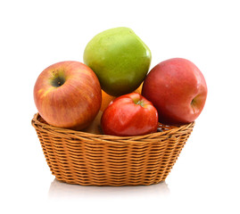 Apples in a wooden basket on white