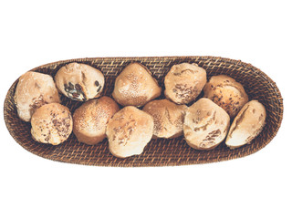topview of home baked buns and bread in bread basket - isolated