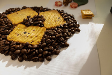 Breakfast coffee cookies morning still life background coffee grain on a white background candy flowers roses