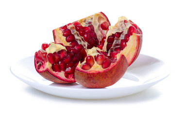 fresh pomegranate on plate on white background isolation