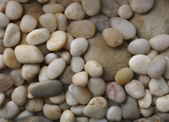 Pebbles from a riverbed. Soft textured stones from natural environments
