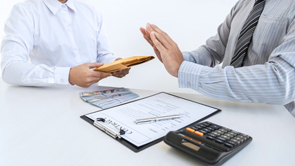 Anti bribery and corruption concept, Business man refusing and don't receive money banknote in...