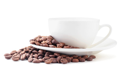 Coffee beans and white cup close-up on a white. Isolated