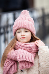 Girl wearing a winter hat and scarf