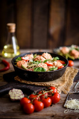 Delicious fresh pasta with meatballs, sauce, cherry tomatoes and basil