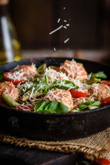 Delicious fresh pasta with meatballs, sauce, cherry tomatoes and basil