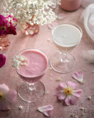 Fototapeta na wymiar A glass of goats milk kefir with blended raspberries