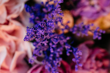 Stylish colorful floral bridal bouquet with roses. Designer fresh flower bouquet from a florist. Beautiful blossoming flower wedding designer bouquet. Close up view